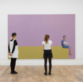 Image of two people admiring a piece of artwork